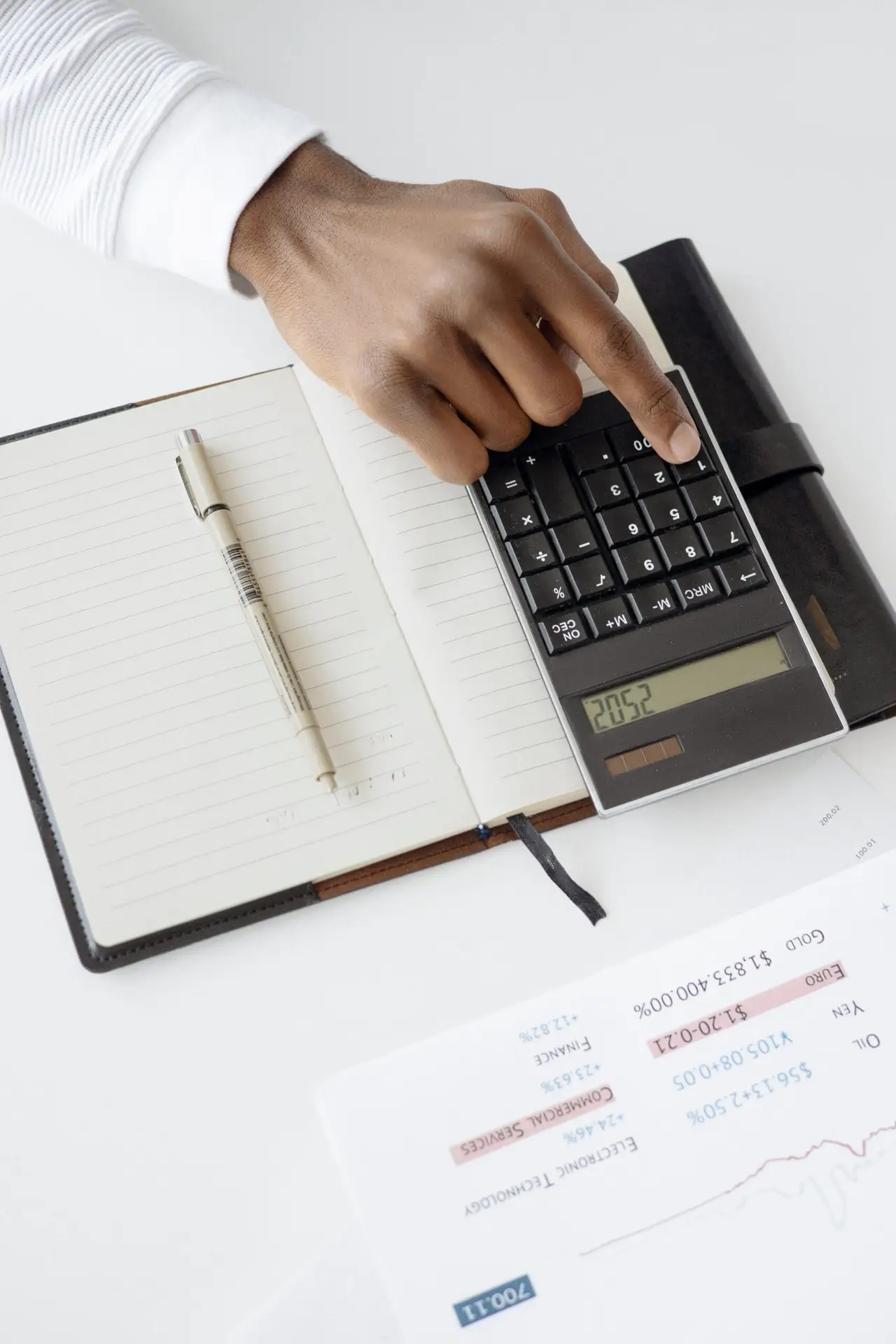 a person using a black calculator