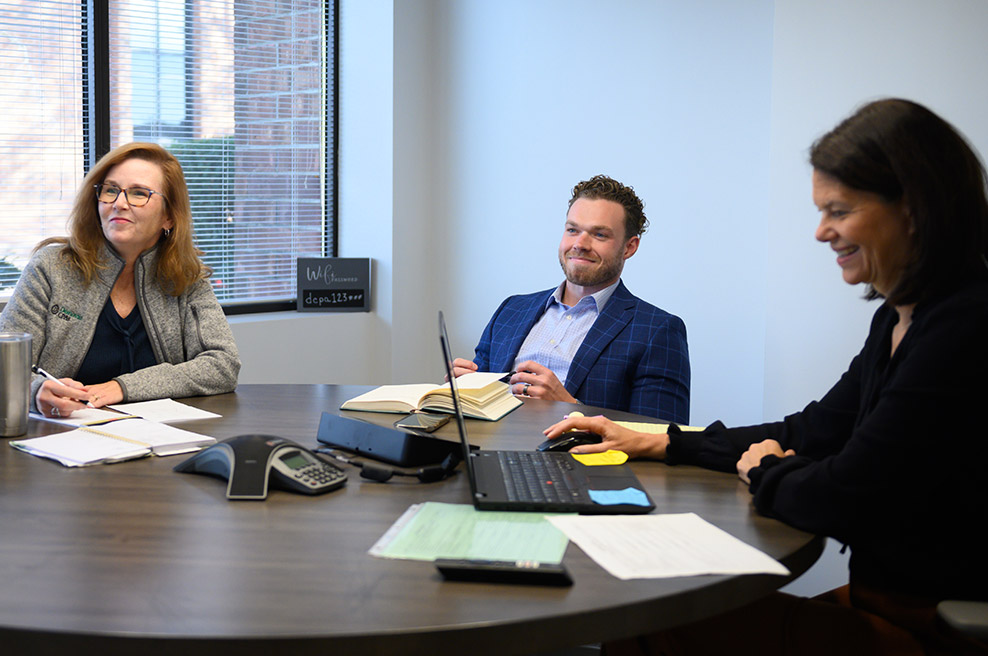 barb and derek in team meeting