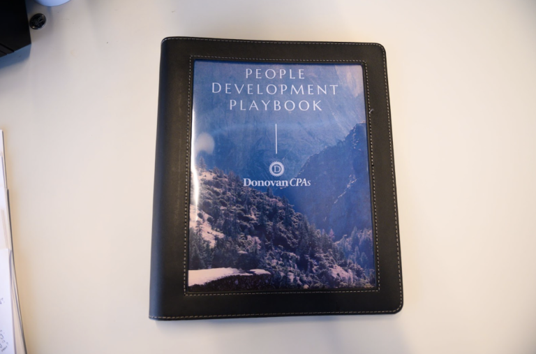 Donovan CPAs playbook resting on table