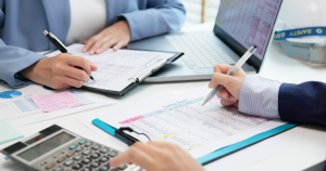 Two professionals reviewing financial documents